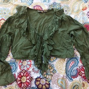 Gauzy green ruffled lace-up blouse